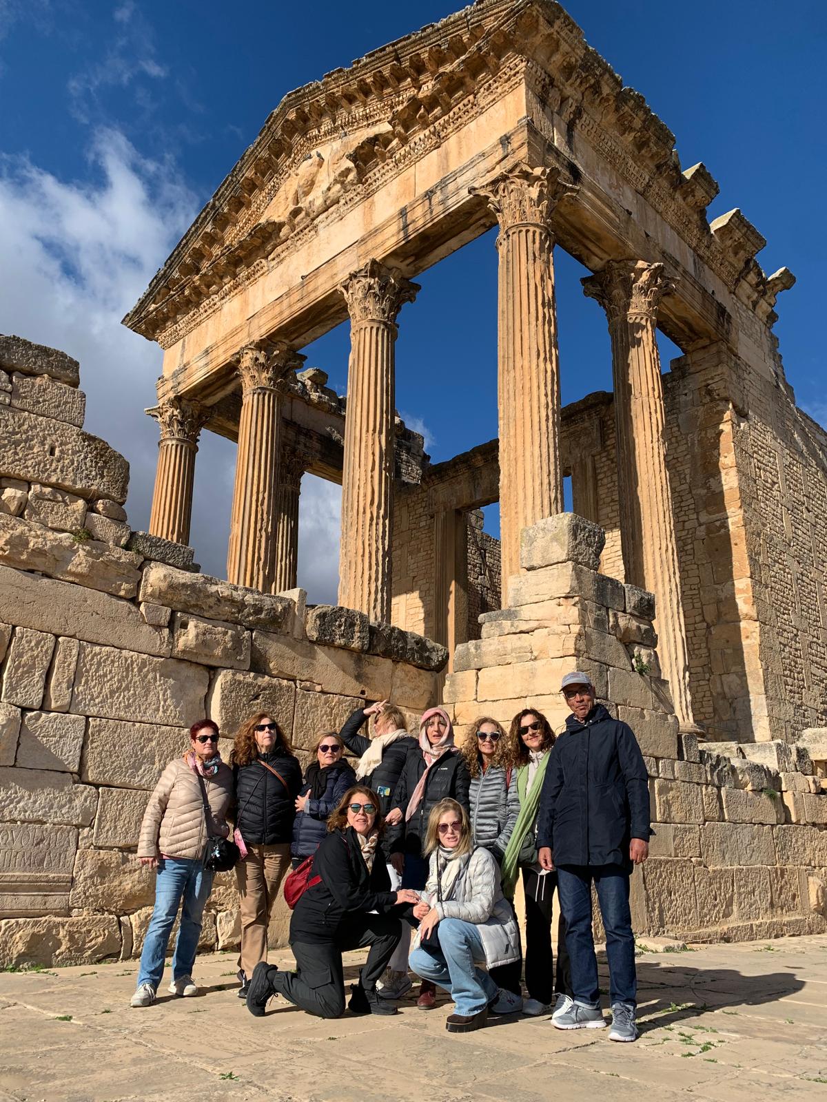 Group of tourists exploring the ancient Roman monument of Sbeitla, Tunisia